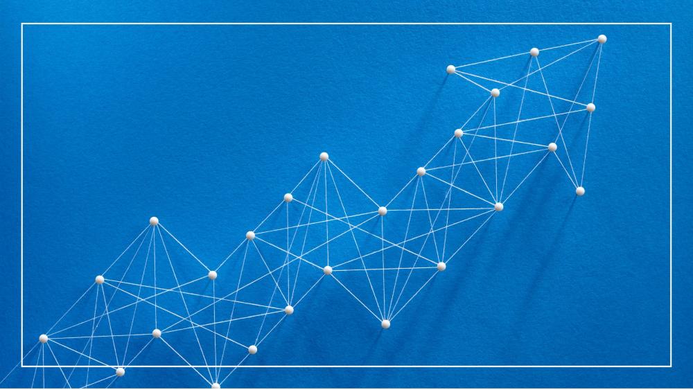 blue background with white lines and dots making up an upward arrow illustrating increase and growth