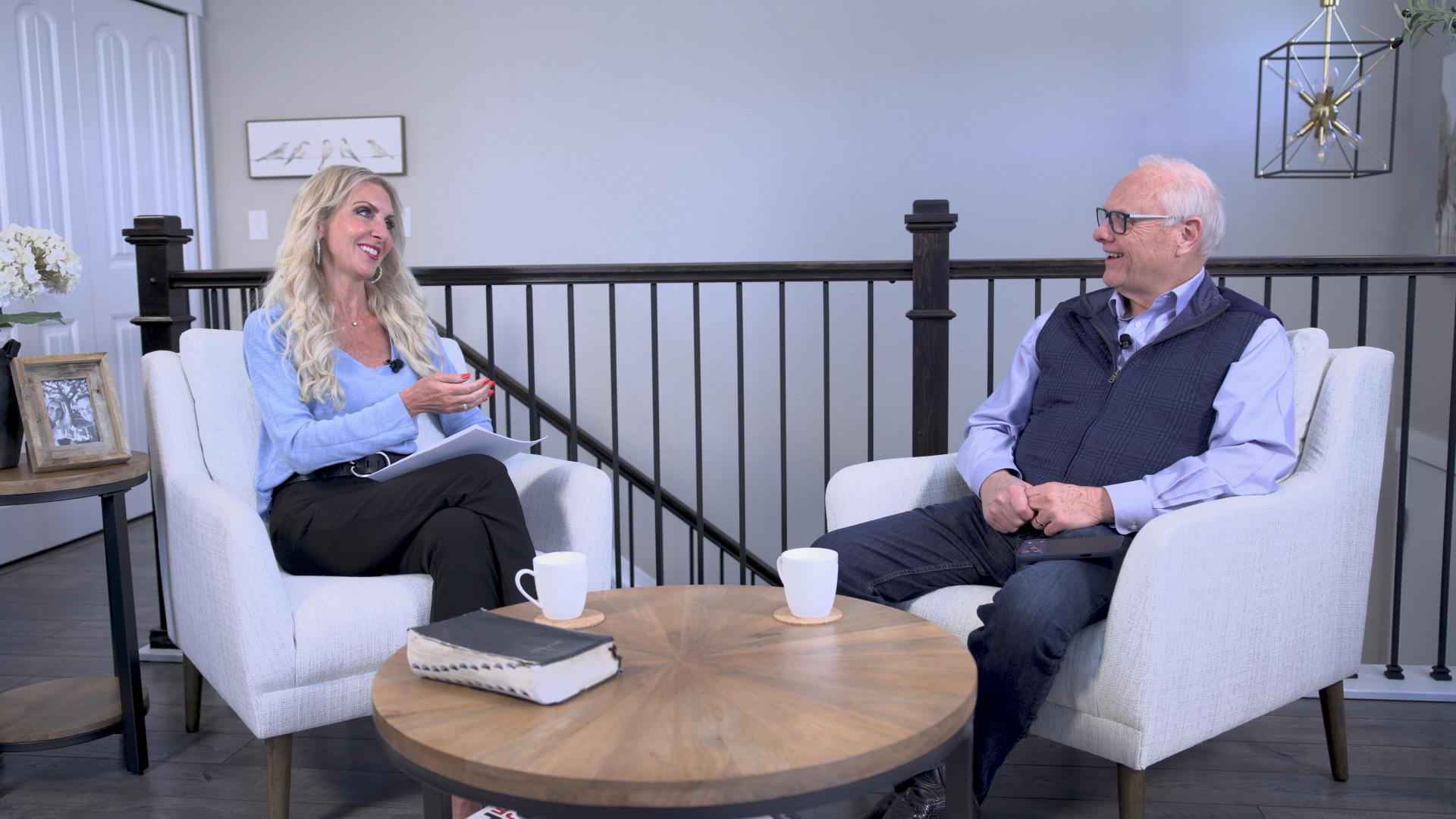 karen conrad metcalfe and billy epperhart doing a show on the set of wealthbuilders tv discussing understanding today;s economic climate