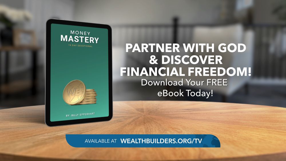 money mastery 14-day devotional cover image with tablet sitting on table with text that says "partner with God & discover financial freedom!" and "download your free eBook today"